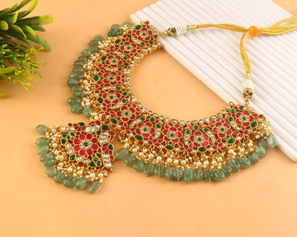 Jadau Kundan Necklace Set is beautifully handcrafted with premium Kundan stones in a classic Jadau setting. Inspired by the royal heritage of Rajasthan and Mughal artistry, this elegant set includes a matching pair