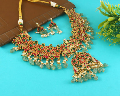 Jadau Kundan Necklace Set is beautifully handcrafted with premium Kundan stones in a classic Jadau setting. Inspired by the royal