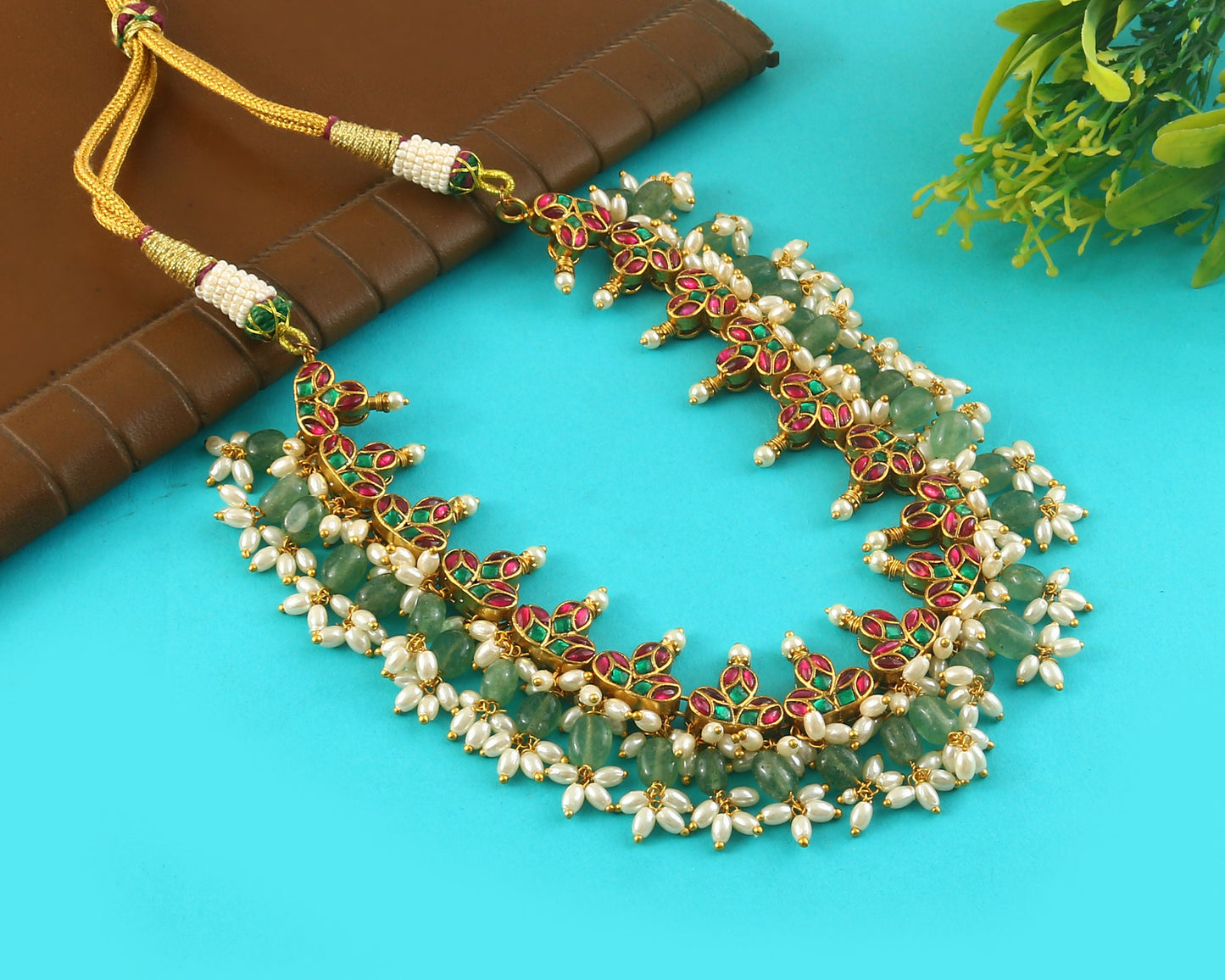 Jadau Kundan Necklace Set is beautifully handcrafted with premium Kundan stones in a classic Jadau setting. Inspired by the royal