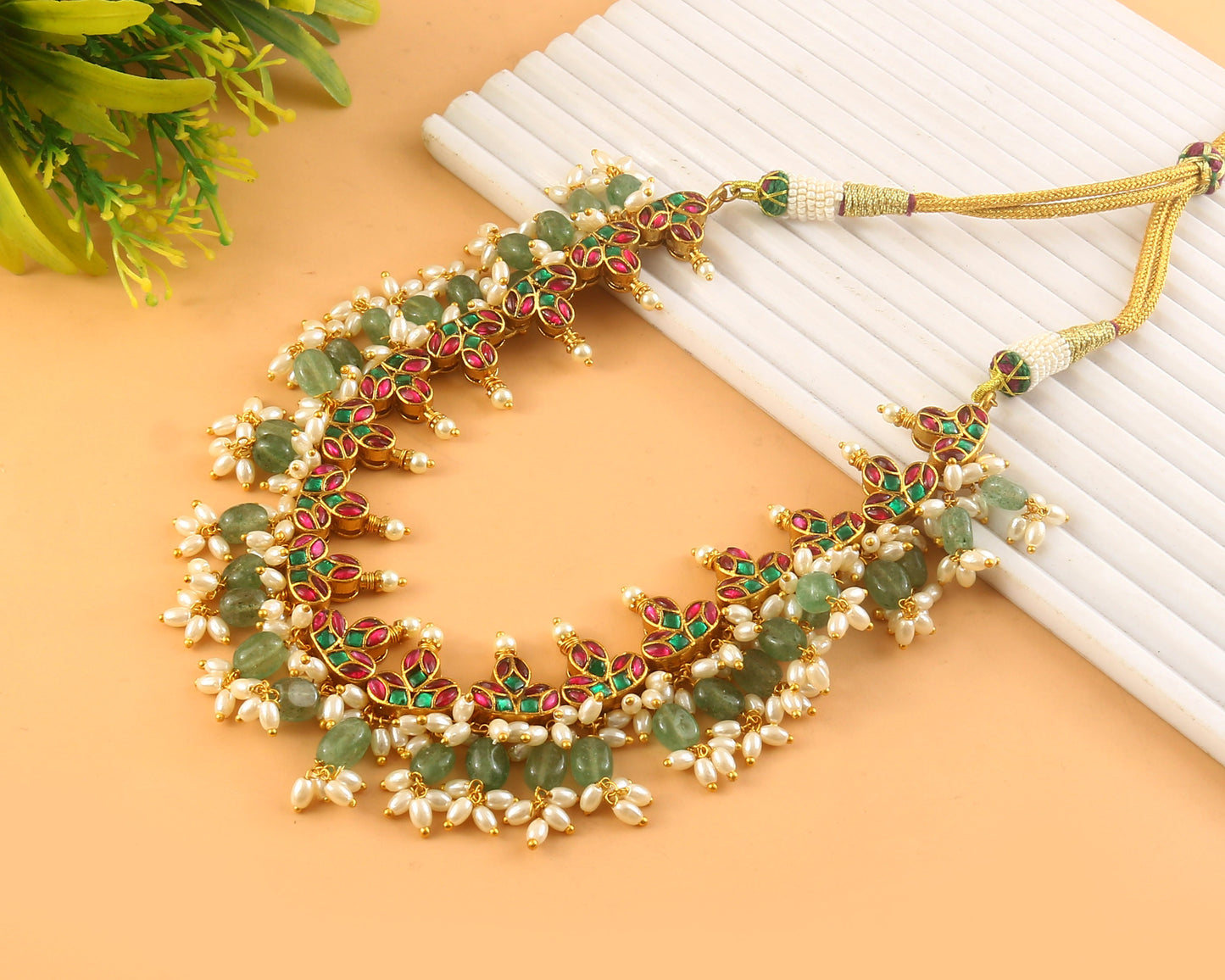 Jadau Kundan Necklace Set is beautifully handcrafted with premium Kundan stones in a classic Jadau setting. Inspired by the royal