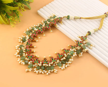 Jadau Kundan Necklace Set is beautifully handcrafted with premium Kundan stones in a classic Jadau setting. Inspired by the royal