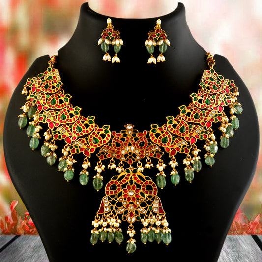 Jadau Kundan Necklace Set is beautifully handcrafted with premium Kundan stones in a classic Jadau setting. Inspired by the royal