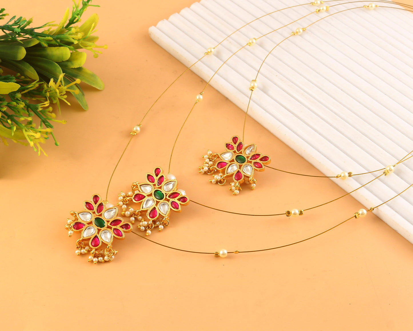 Jadau Kundan Necklace Set is beautifully handcrafted with premium Kundan stones in a classic Jadau setting. Inspired by the royal