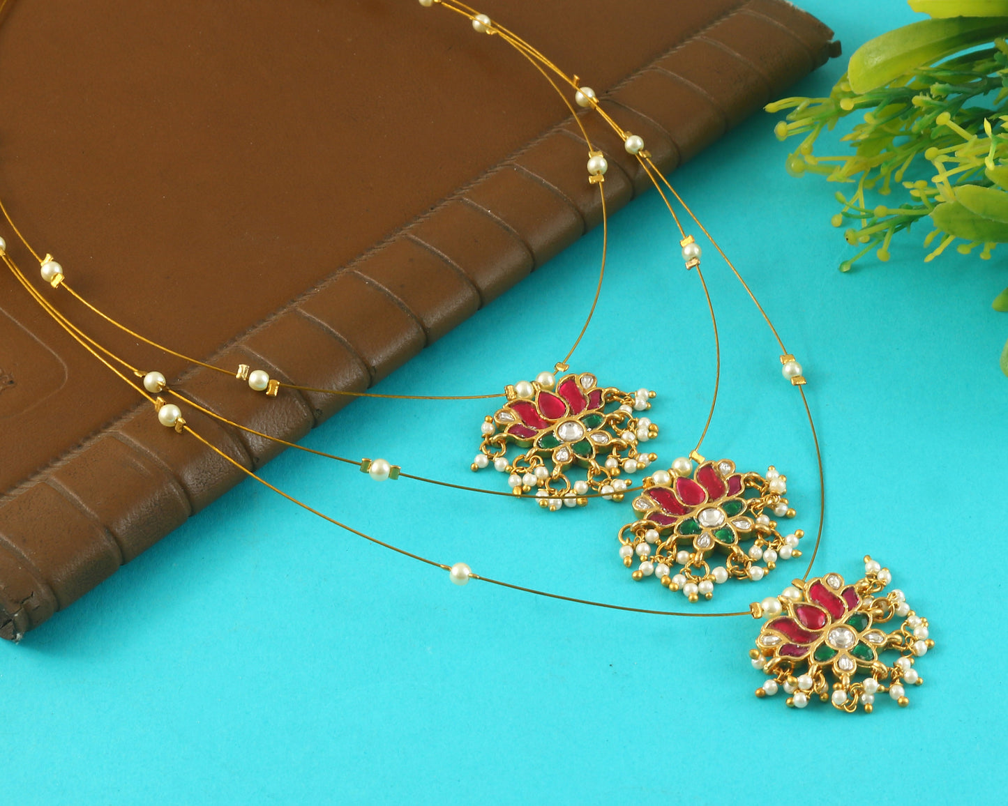 Jadau Kundan Necklace Set is beautifully handcrafted with premium Kundan stones in a classic Jadau setting. Inspired by the royal