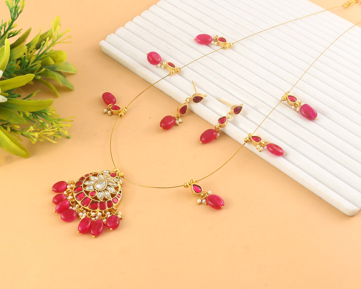 Jadau Kundan Necklace Set is beautifully handcrafted with premium Kundan stones in a classic Jadau setting. Inspired by the royal