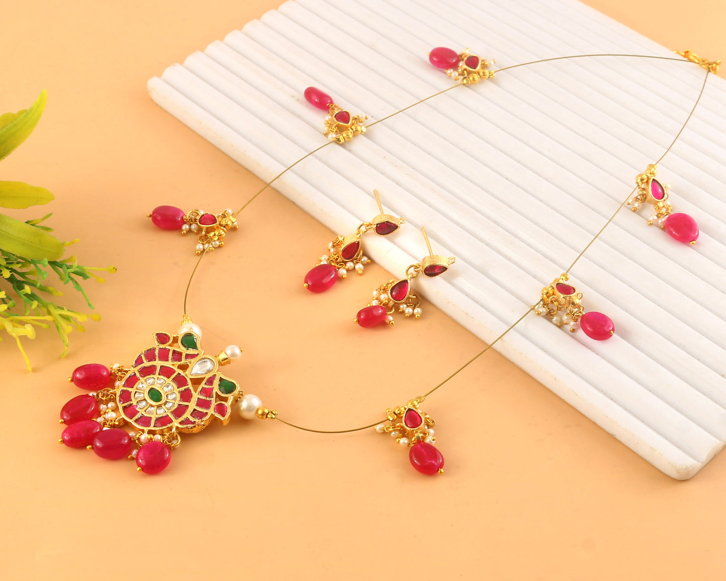 Jadau Kundan Necklace Set is beautifully handcrafted with premium Kundan stones in a classic Jadau setting. Inspired by the royal
