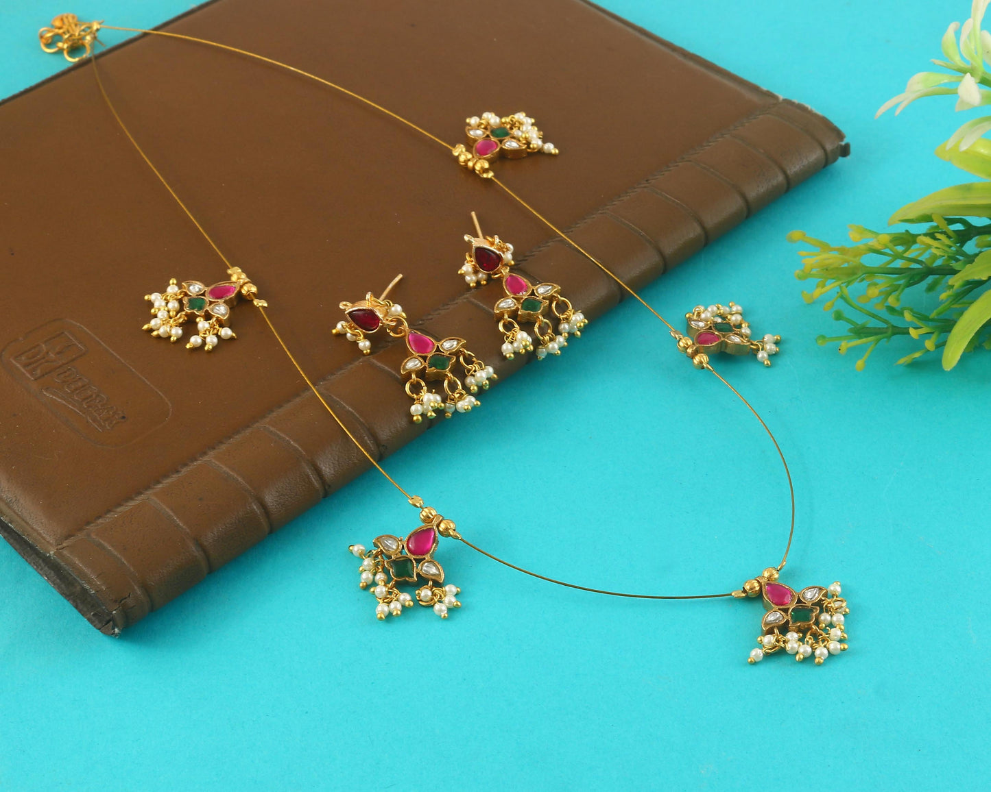 Jadau Kundan Necklace Set is beautifully handcrafted with premium Kundan