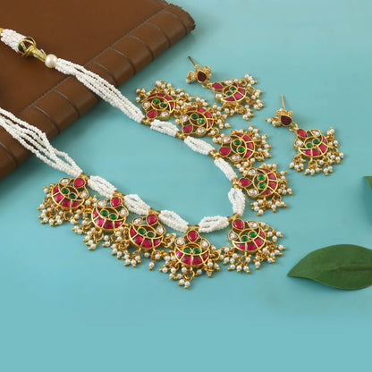 Pendant necklace featuring a charm chain